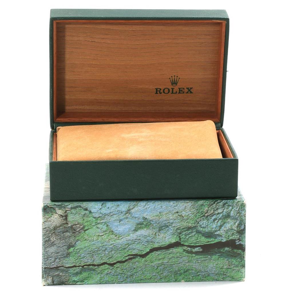 The image shows the open box of a Rolex Mid-Size 68273 Women's Steel and Gold (two tone) Beige Dial 68273 Women's Steel and Gold (two tone) Beige Dial model watch, revealing the interior cushion and brand logo.