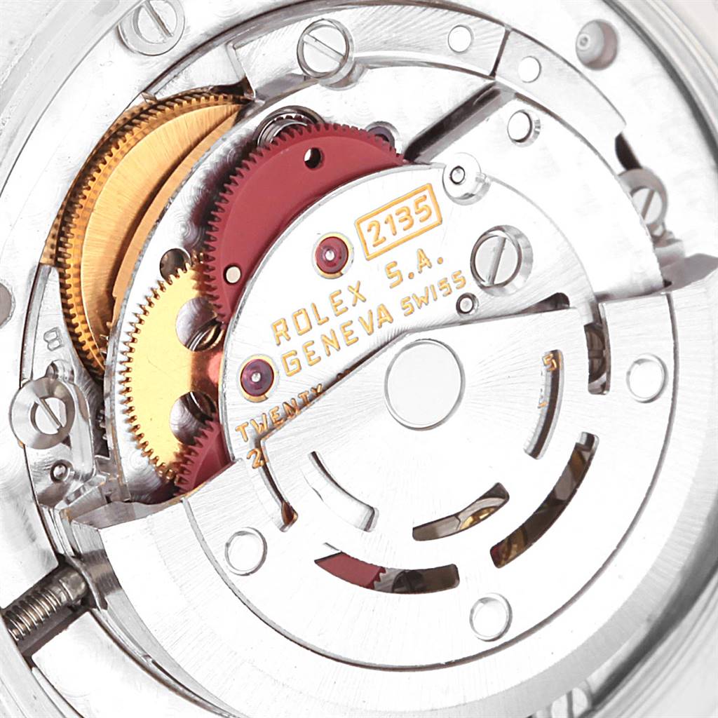 This image shows the internal movement mechanism of a Rolex Mid-Size 68273 Women's Steel and Gold (two tone) Champagne Dial 68273 Women's Steel and Gold (two tone) Champagne Dial model, specifically the rotor and gears.