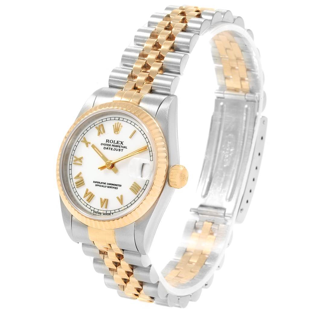 The Rolex Mid-Size 68273 Women's Steel and Gold (two tone) White Dial 68273 Women's Steel and Gold (two tone) White Dial Datejust watch is shown from an oblique angle displaying its face, bezel, crown, and bracelet.