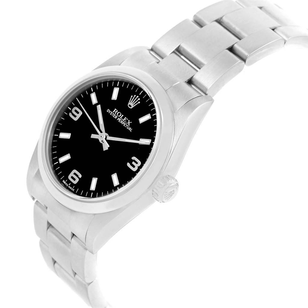 The image shows a side angle of a Rolex Mid-Size 77080 Women's Stainless Steel Black Dial 77080 Women's Stainless Steel Black Dial Oyster Perpetual watch, highlighting the dial, crown, and bracelet.