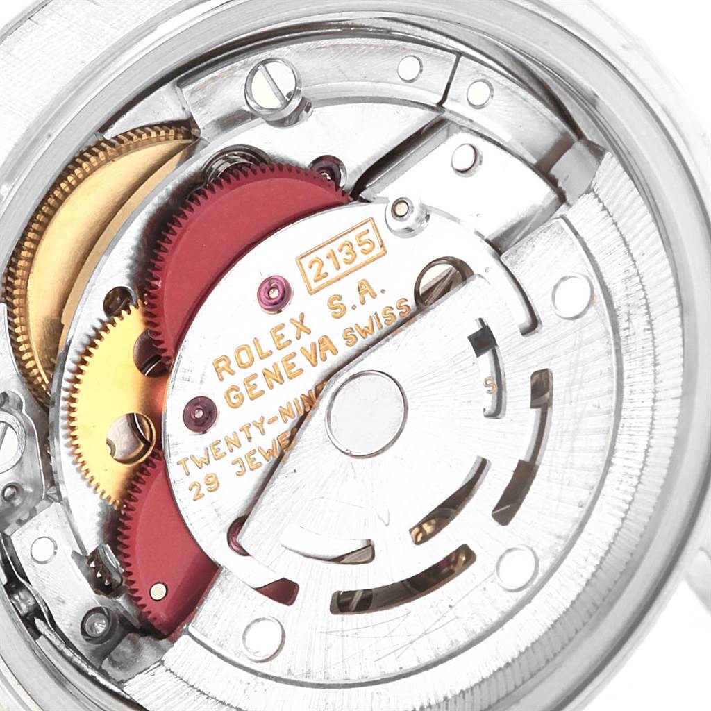 This image shows the internal mechanism and movement of a Mid-Size Rolex watch from a close-up angle.