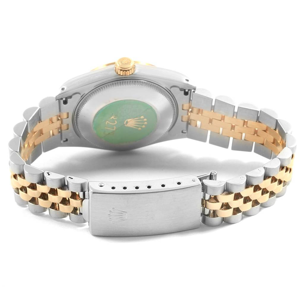 This image shows the back view of a Mid-Size Rolex watch, highlighting the bracelet and clasp.