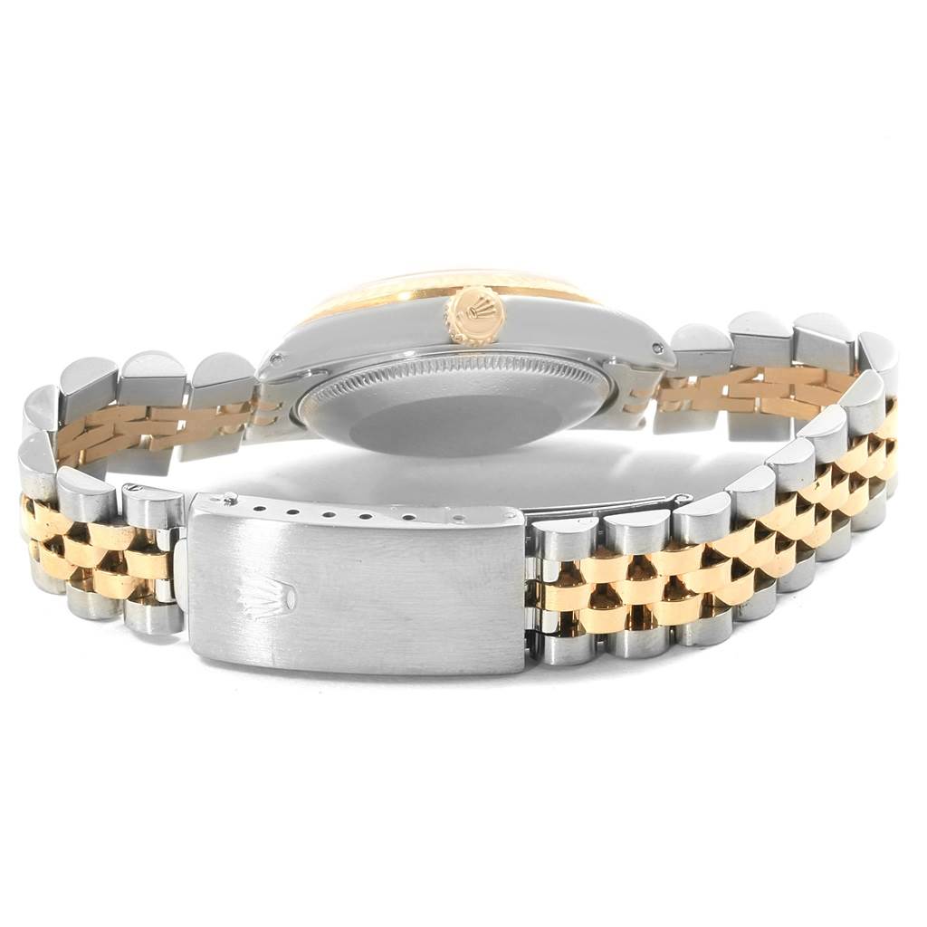 This image shows the underside and back side of the Rolex Mid-Size 68273 Women's Steel and Gold (two tone) Champagne Dial 68273 Women's Steel and Gold (two tone) Champagne Dial model watch, focusing on the case back and bracelet clasp.