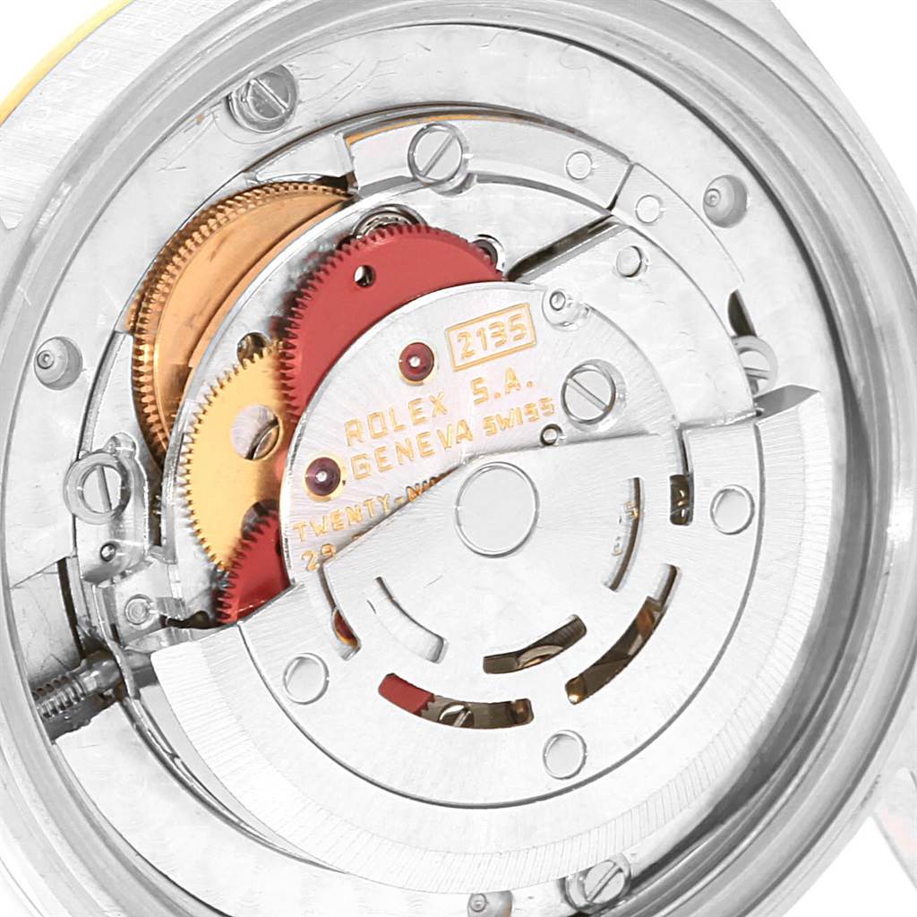 The image shows a close-up of the movement mechanism of a Rolex Mid-Size 68273 Women's Steel and Gold (two tone) Champagne Dial 68273 Women's Steel and Gold (two tone) Champagne Dial watch from the back.