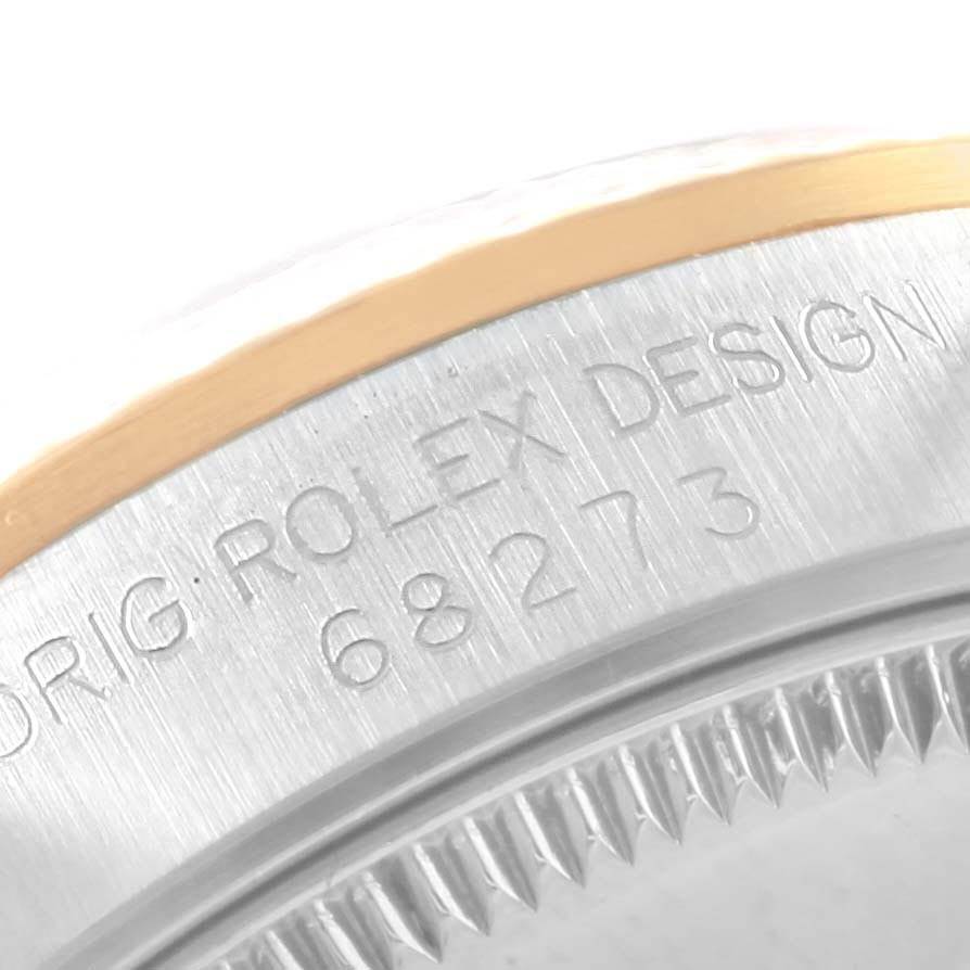 The image shows a close-up of the model number 68273 on the bezel of a Mid-Size Rolex watch.