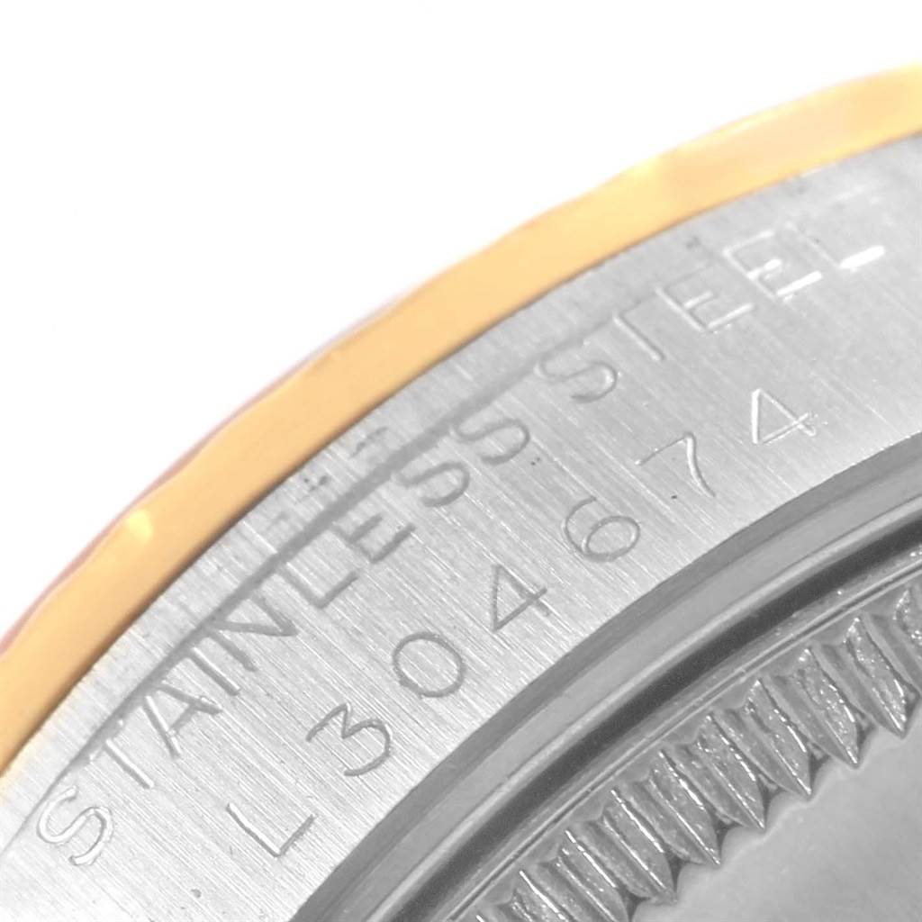 This close-up image shows the model number and stainless steel engraving on the side of a Rolex Mid-Size 68273 Women's Steel and Gold (two tone) Champagne Dial 68273 Women's Steel and Gold (two tone) Champagne Dial watch bezel.