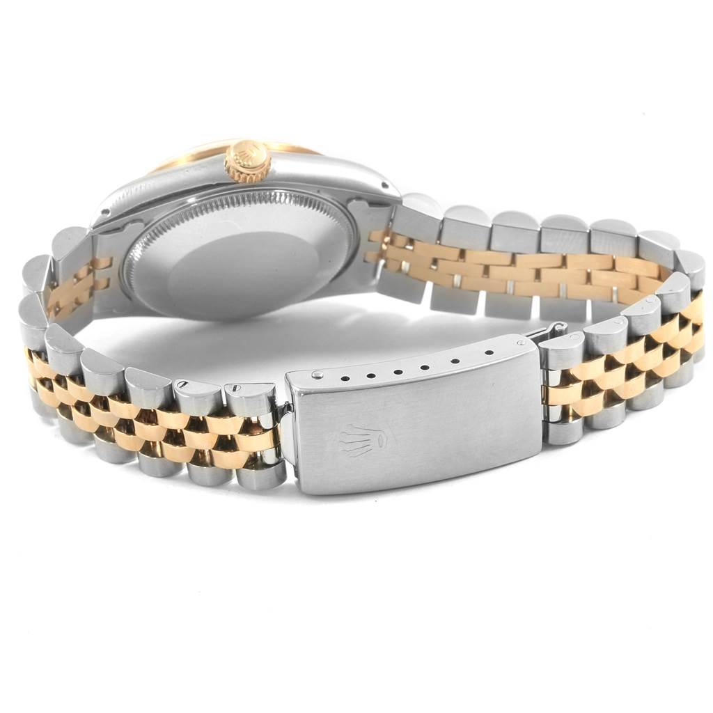 This image shows the back case, crown, and bracelet of a Mid-Size Rolex watch.