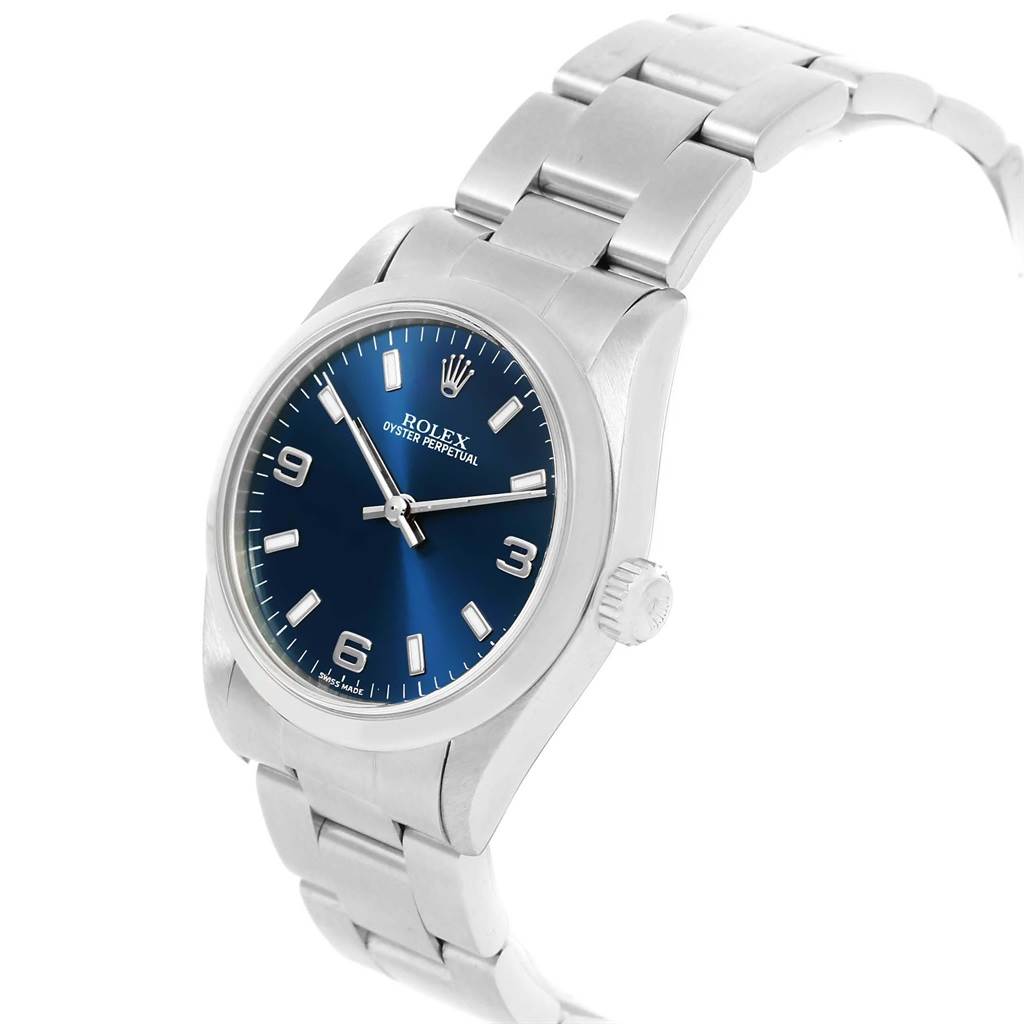 The image shows a Rolex Mid-Size 77080 Women's Stainless Steel Blue Dial 77080 Women's Stainless Steel Blue Dial Oyster Perpetual watch at a slight angle highlighting the blue dial, stainless steel case, crown, and bracelet.