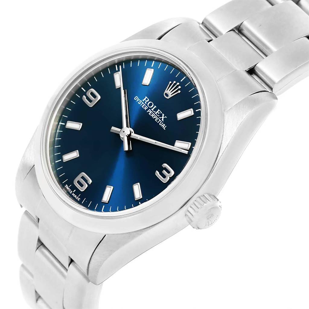 This image shows a Rolex Oyster Perpetual Mid-Size watch at a slight angle, displaying the dial, crown, and part of the bracelet.