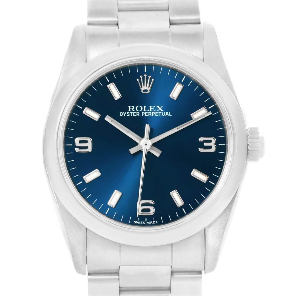 The image shows a frontal view of a Mid-Size Rolex Oyster Perpetual watch with a blue dial and silver bracelet.