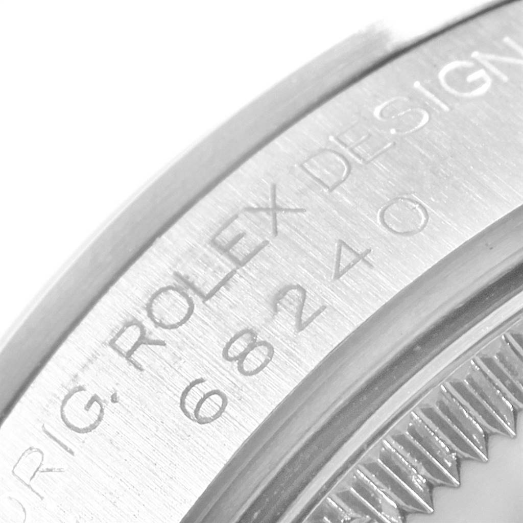 The image shows a close-up of the side engraving on a Mid-Size Rolex watch, featuring model number 68240.