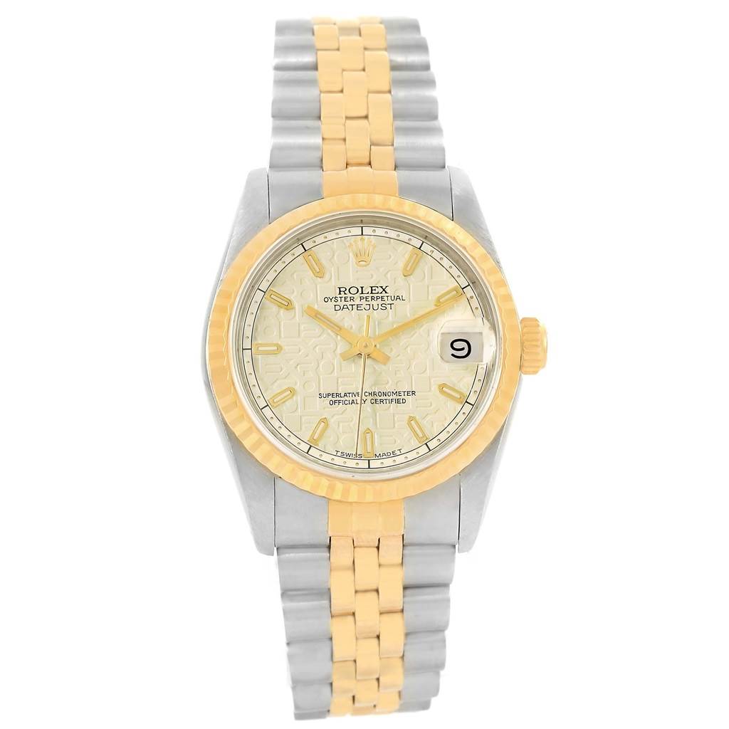 This image shows a front view of a Rolex Mid-Size 68273 Women
s Steel and Gold (two tone) Beige Dial 68273 Women
s Steel and Gold (two tone) Beige Dial Datejust watch, featuring a two-tone bracelet and bezel with a patterned dial.