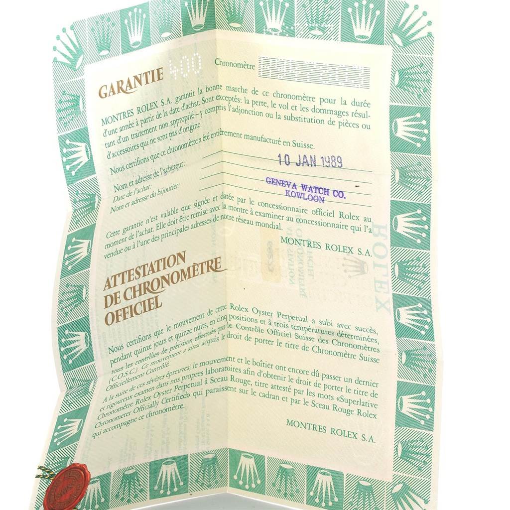 This image shows the official warranty and certification paperwork for a Mid-Size Rolex watch.