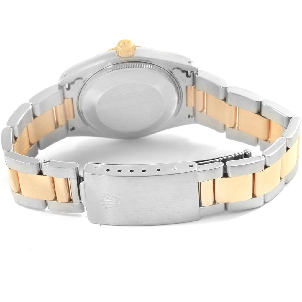 This is a rear view of a Rolex Mid-Size 67513 Women's Steel and Gold (two tone) Blue Dial 67513 Women's Steel and Gold (two tone) Blue Dial watch, showcasing the back case and two-tone strap with a clasp.