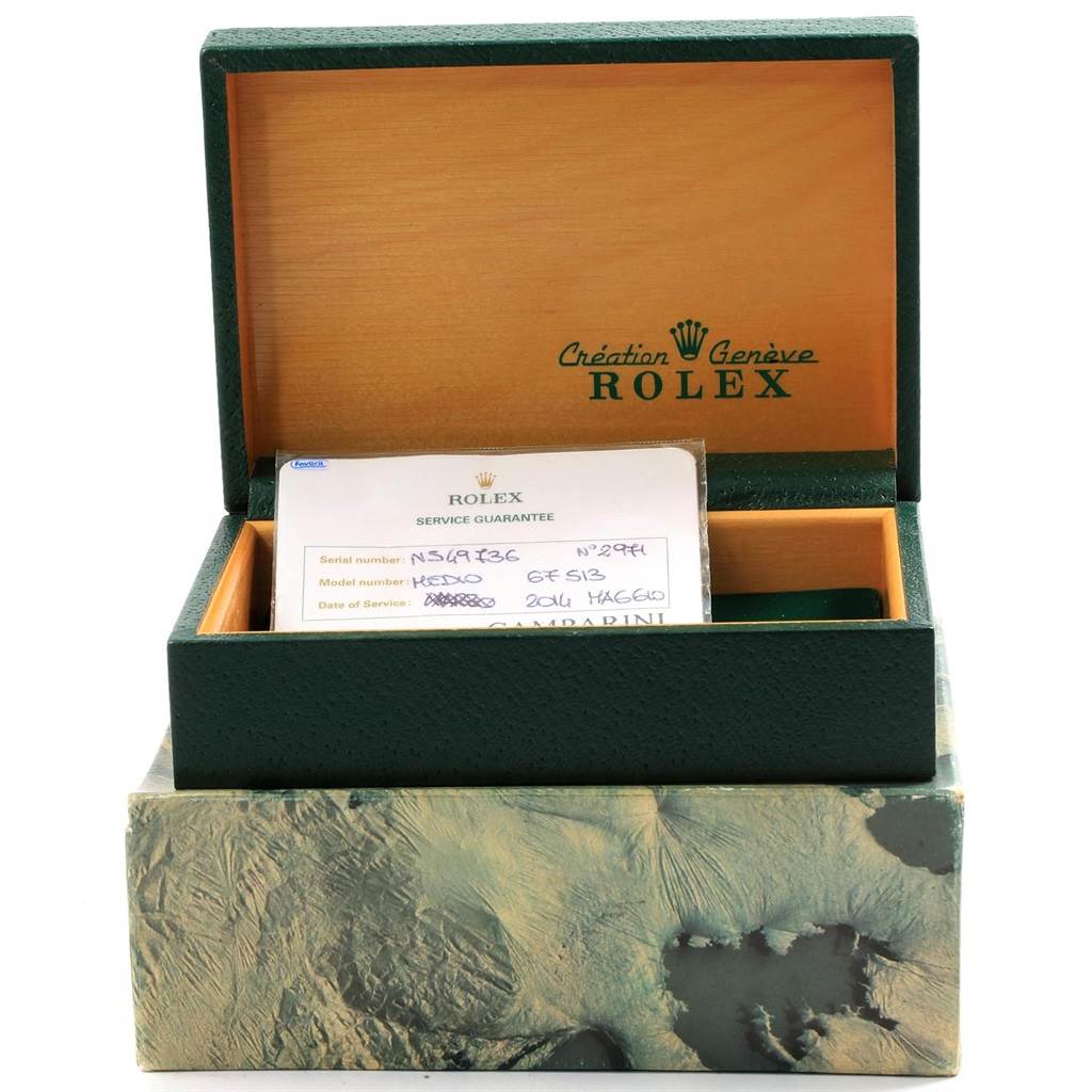 The image features a Rolex Mid-Size 67513 Women's Steel and Gold (two tone) Blue Dial 67513 Women's Steel and Gold (two tone) Blue Dial model watch box, shown open with a service guarantee card inside.