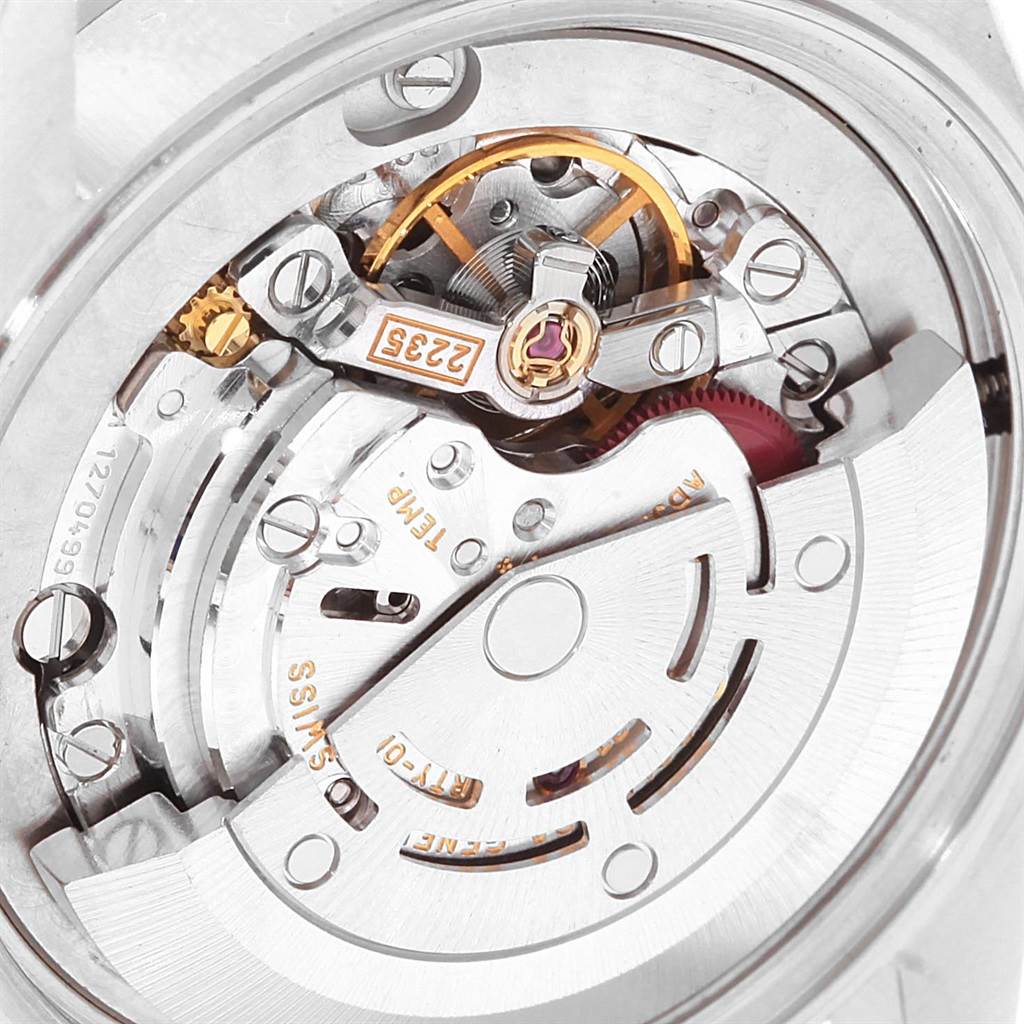 This image displays the intricate internal mechanism of a Rolex Mid-Size 78240 Women's Stainless Steel Blue Dial 78240 Women's Stainless Steel Blue Dial watch from a close-up, top-down angle.