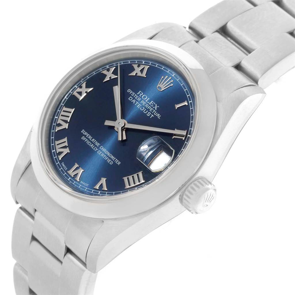 This Rolex Mid-Size 78240 Women's Stainless Steel Blue Dial 78240 Women's Stainless Steel Blue Dial model watch is shown at an angle highlighting its blue dial, Roman numerals, date magnifier, and metal bracelet.