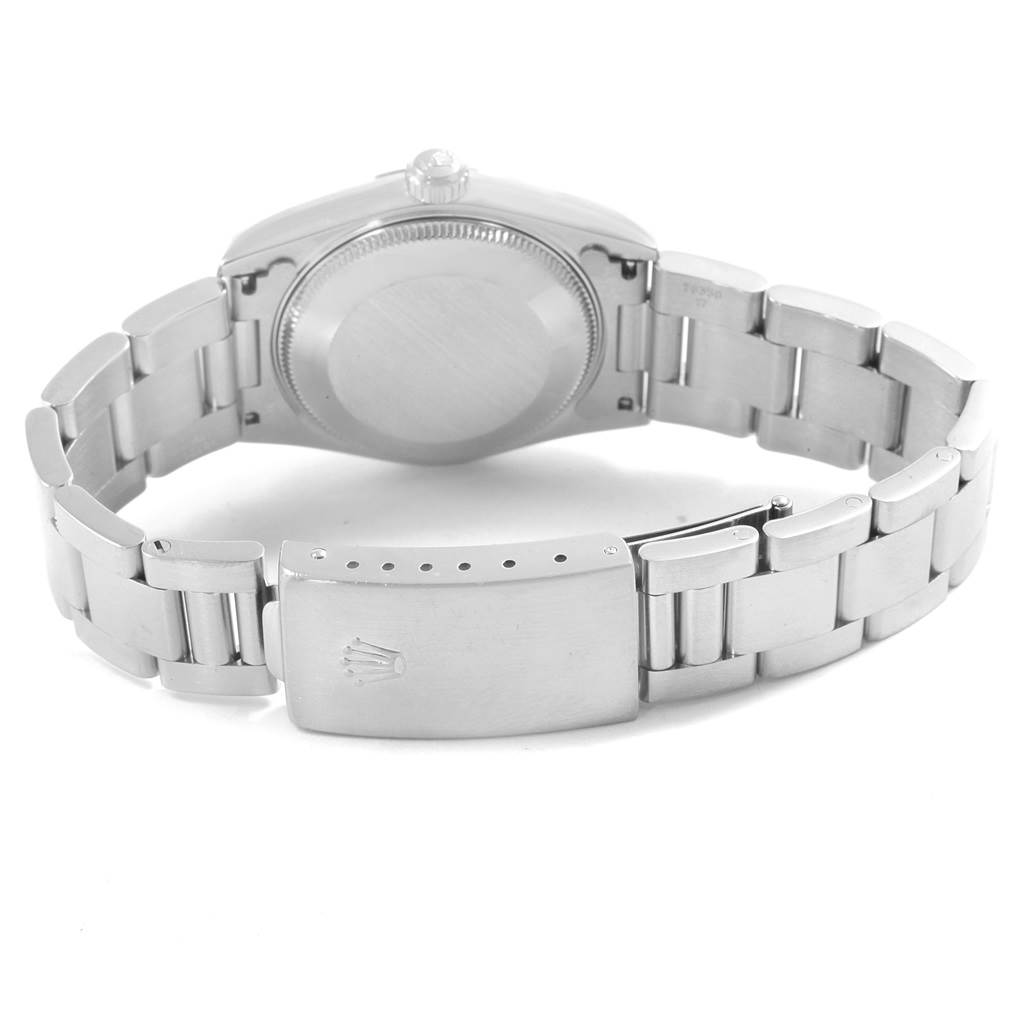 The image shows the back case and bracelet clasp of a Mid-Size Rolex watch.