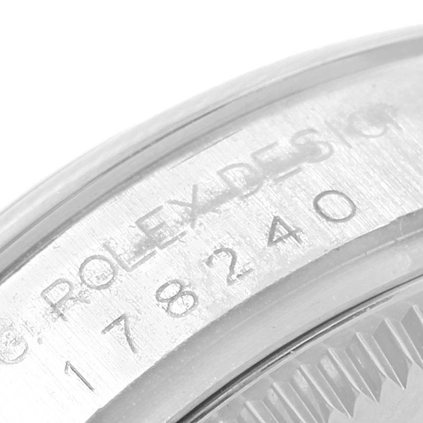 The image shows a close-up of the engraved serial number and "Rolex Design" on the case of a Rolex Mid-Size 178240 Women's Stainless Steel Pink Dial 178240 Women's Stainless Steel Pink Dial watch.
