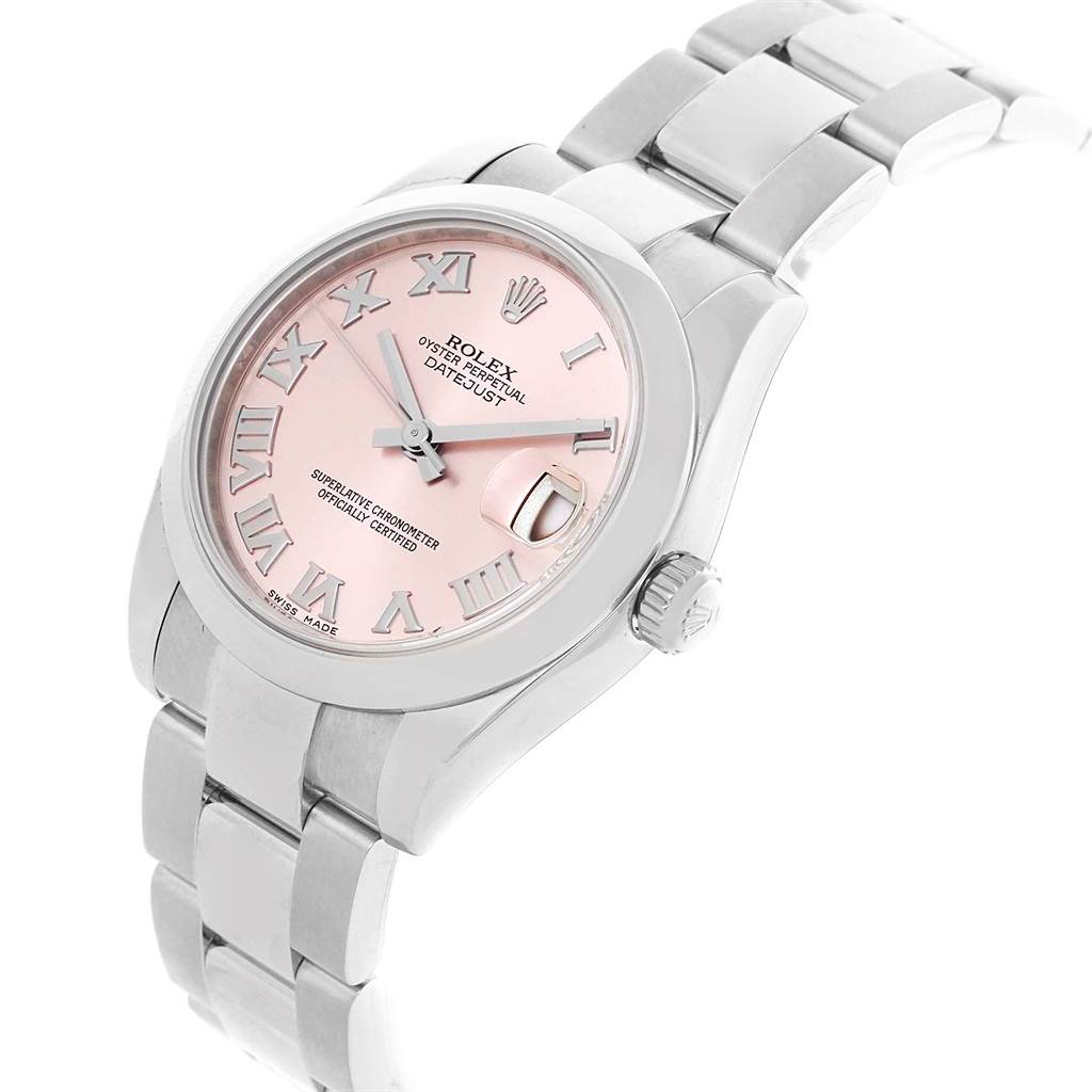 This image shows a Rolex Datejust Mid-Size watch at an angled top view, detailing the pink dial, Roman numerals, and metal bracelet.