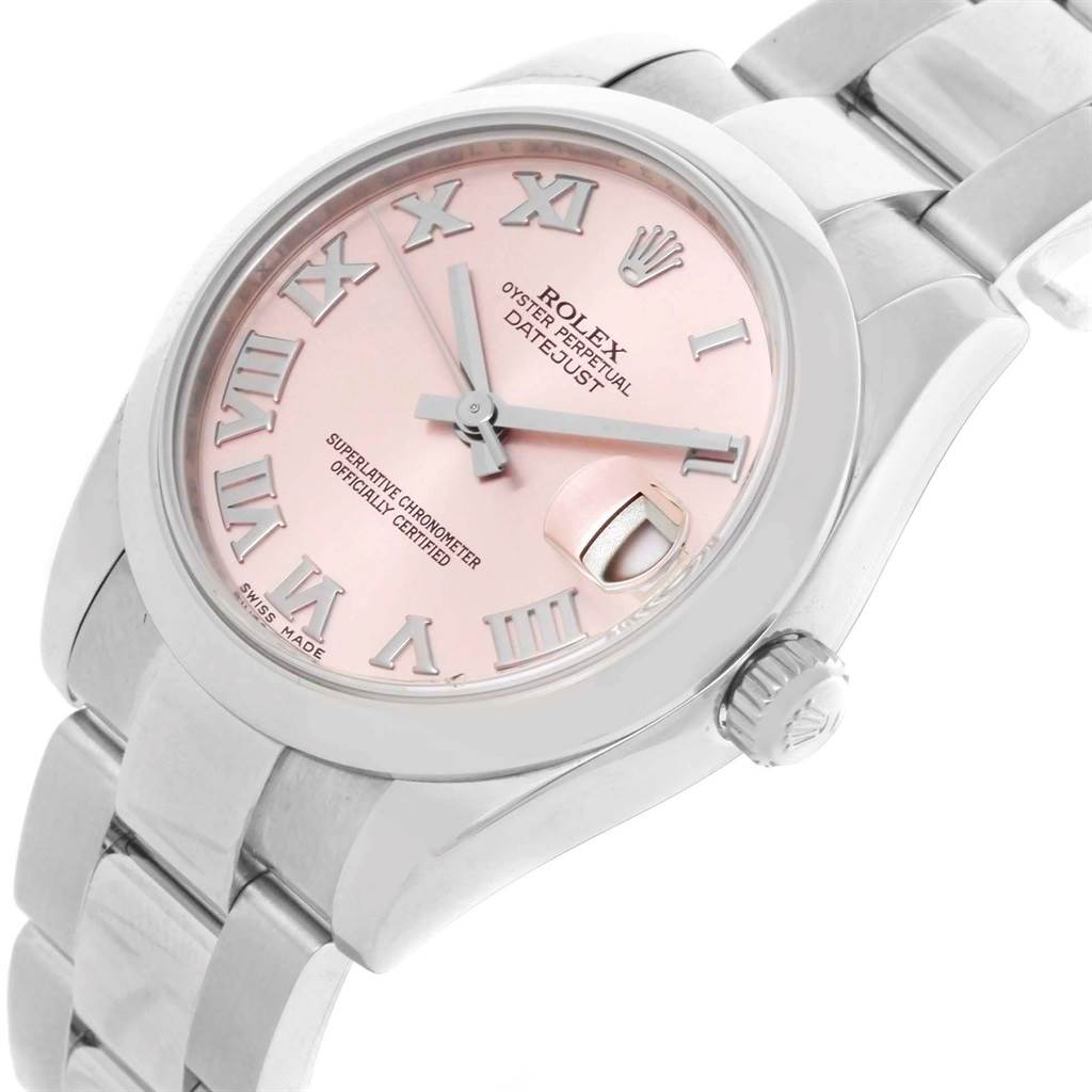 The image shows a Rolex Oyster Perpetual Datejust Mid-Size watch with a pink dial and Roman numerals, viewed at an angle from the top-right.