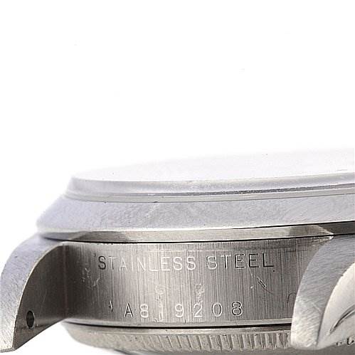 This image shows a side angle of the casing of a Rolex Mid-Size 78240 Women's Stainless Steel Blue Dial 78240 Women's Stainless Steel Blue Dial model watch, highlighting the stainless steel material and serial number.