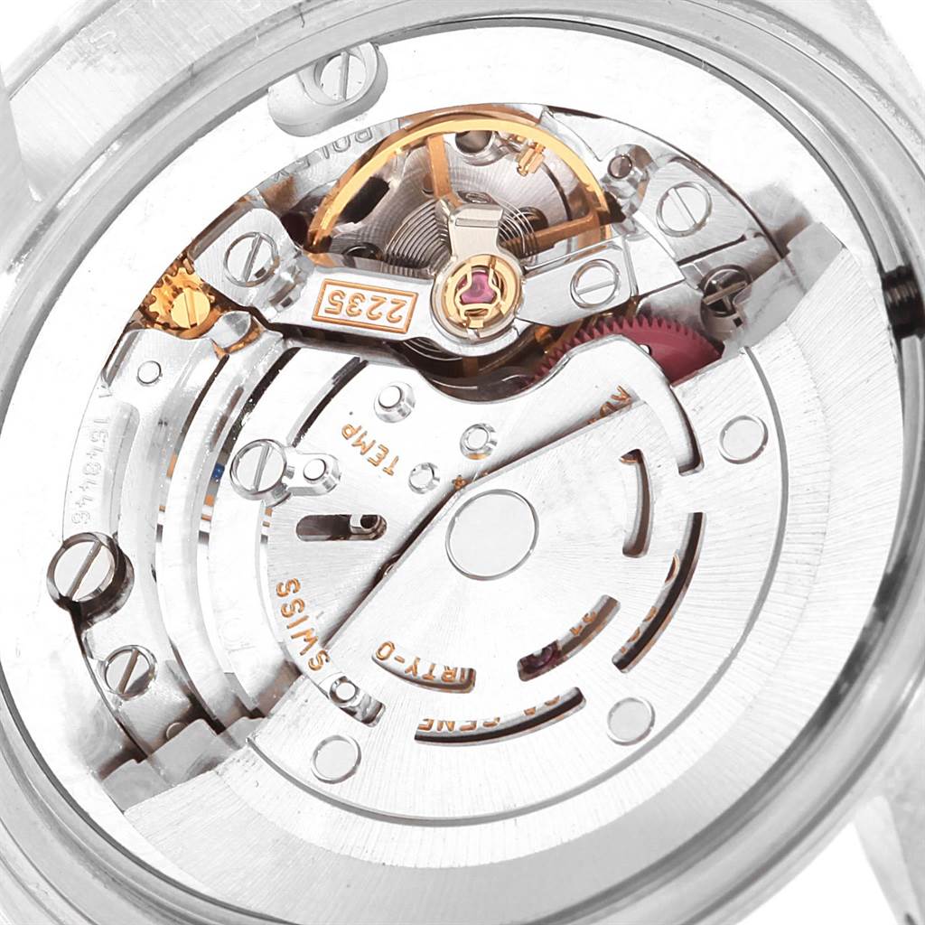The image shows the movement mechanism of a Mid-Size Rolex watch, viewed from the back.