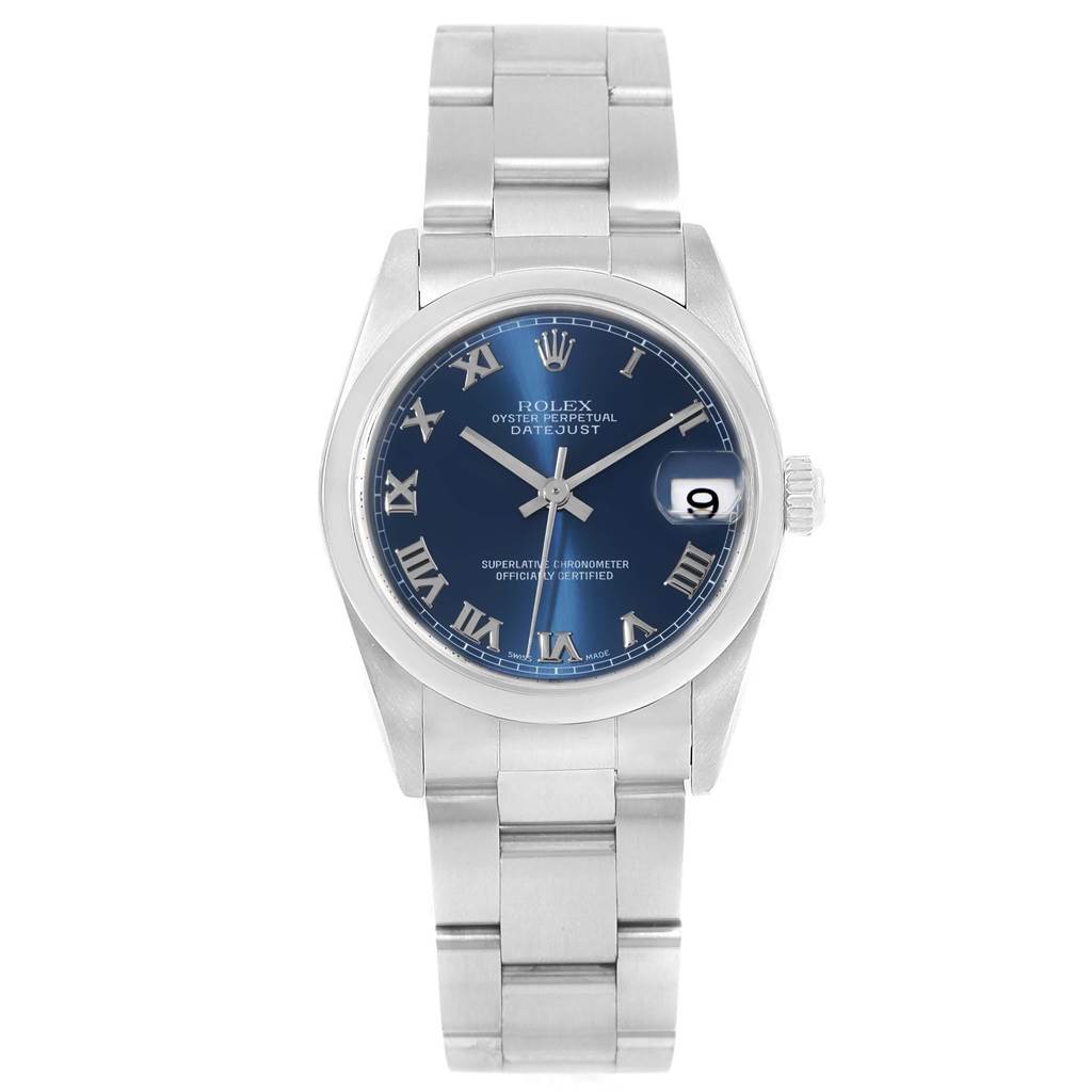 This image shows a frontal view of the Mid-Size Rolex Datejust watch, displaying its blue dial, roman numerals, and metal band.