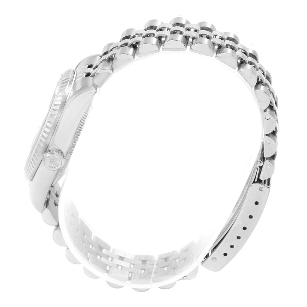 The side view of a Rolex Mid-Size 78274 Women's Stainless Steel Pink Dial 78274 Women's Stainless Steel Pink Dial model shows the bracelet, crown, and part of the watch case.