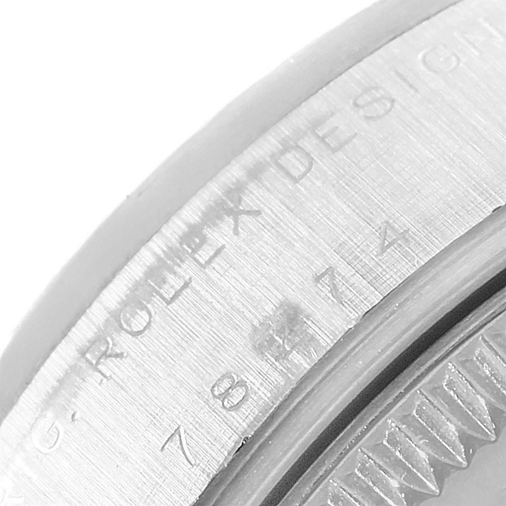 The image shows a close-up angle of the case side of the Rolex Mid-Size 78274 Women's Stainless Steel Pink Dial 78274 Women's Stainless Steel Pink Dial model with partial serial number and "ROLEX DESIGN" text.