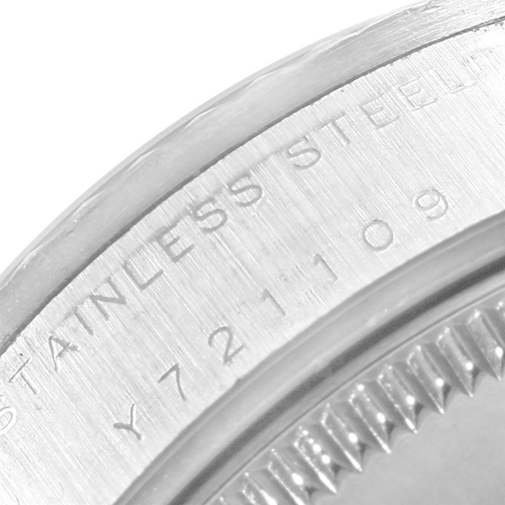This close-up image shows the side of the caseback, including the serial number and "STAINLESS STEEL" engraving of a Rolex Mid-Size 78274 Women's Stainless Steel Pink Dial 78274 Women's Stainless Steel Pink Dial model.