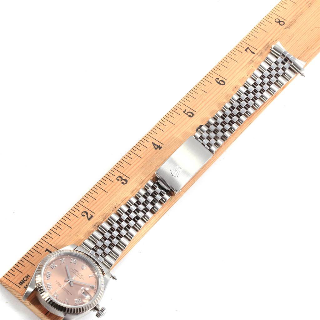 The image shows a Rolex Mid-Size 78274 Women's Stainless Steel Pink Dial 78274 Women's Stainless Steel Pink Dial watch placed next to a ruler, displaying the watch face and metal bracelet.