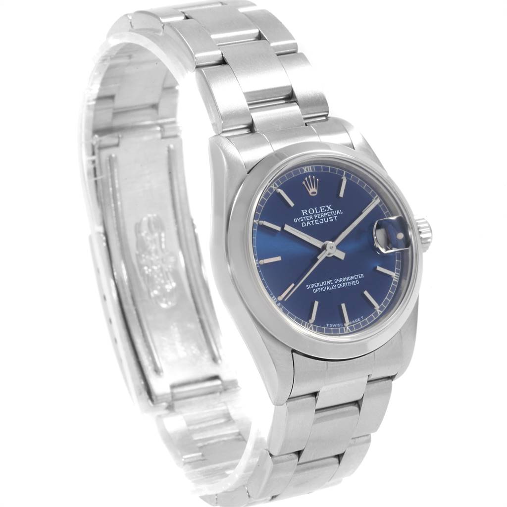 The image shows a Rolex Mid-Size 68240 Women's Stainless Steel Blue Dial 68240 Women's Stainless Steel Blue Dial model watch at a slightly tilted angle, highlighting its blue dial, case, and metal bracelet.
