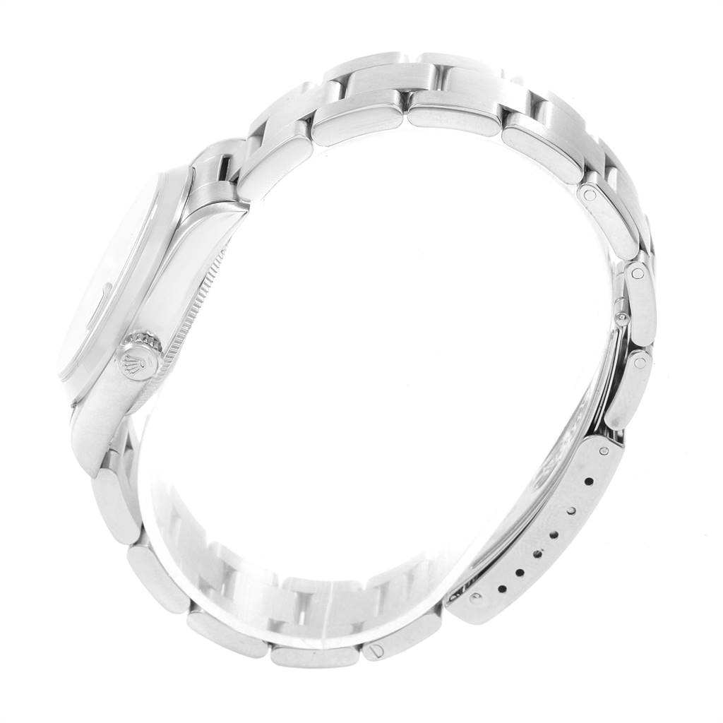 The image shows a side profile of the Rolex Mid-Size 68240 Women's Stainless Steel Blue Dial 68240 Women's Stainless Steel Blue Dial watch, highlighting the bracelet and part of the case and crown.