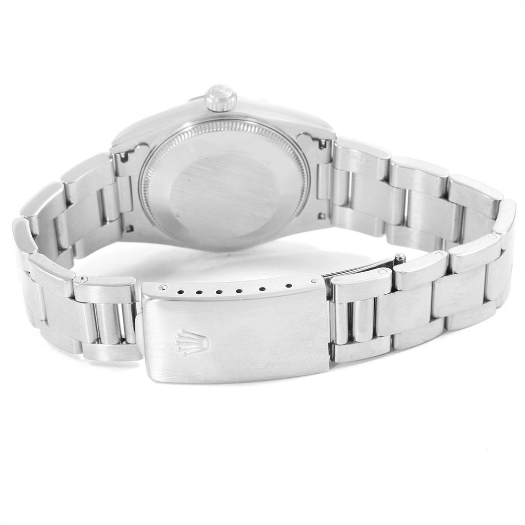 The image shows the back view of a Mid-Size Rolex watch, highlighting the case back and the bracelet clasp.