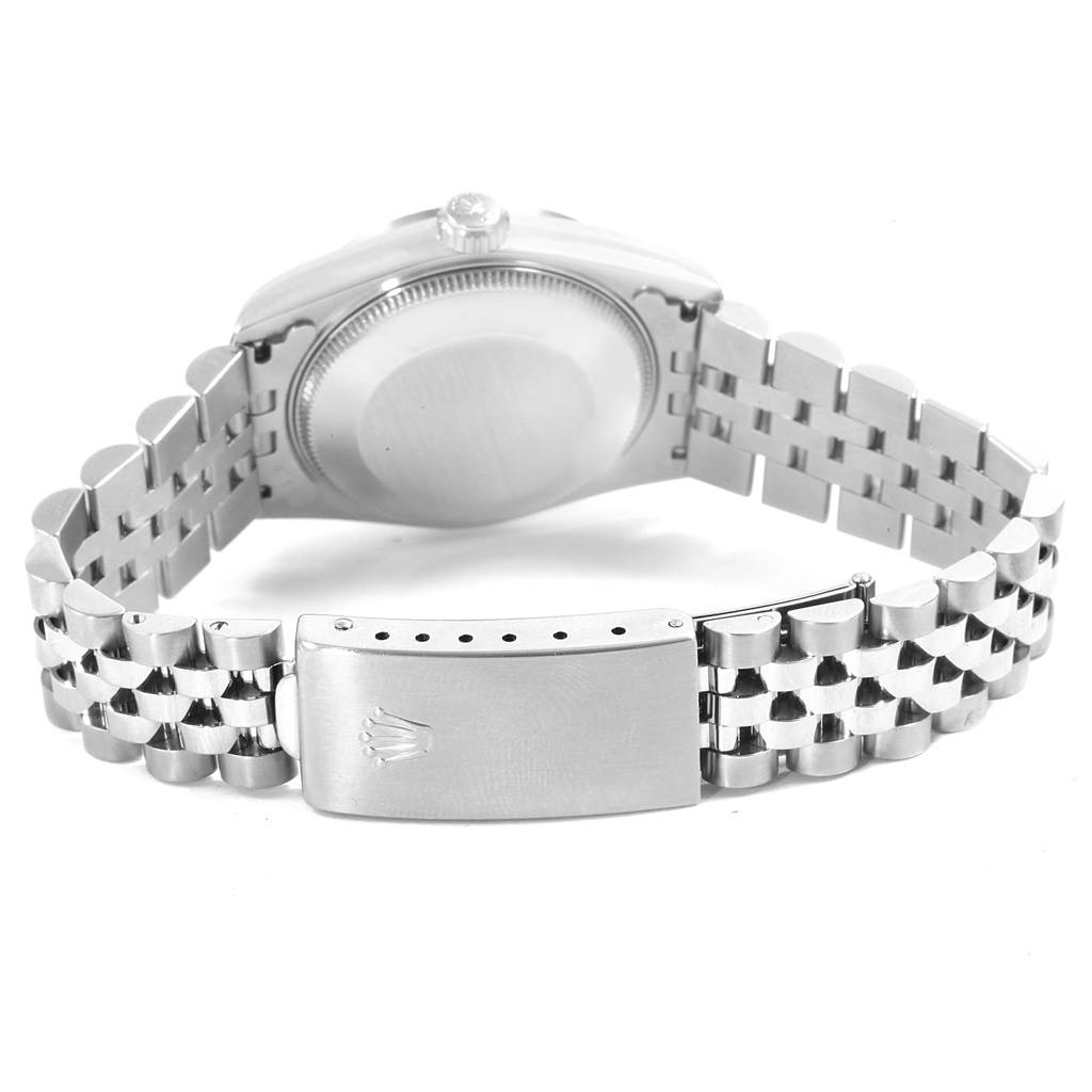 The image shows the back case and bracelet clasp of a Mid-Size Rolex watch.