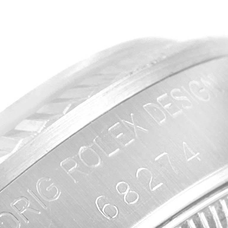 The image shows a close-up of the engraved side of a Mid-Size Rolex watch model 68274.