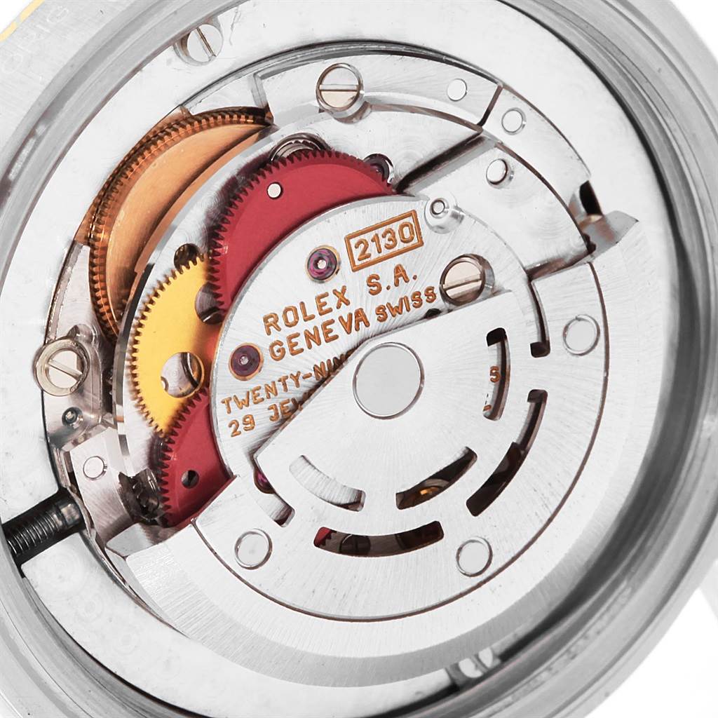 This image shows the movement mechanism of the Rolex Mid-Size 67513 Women's Steel and Gold (two tone) Black Dial 67513 Women's Steel and Gold (two tone) Black Dial model watch from a back view angle.