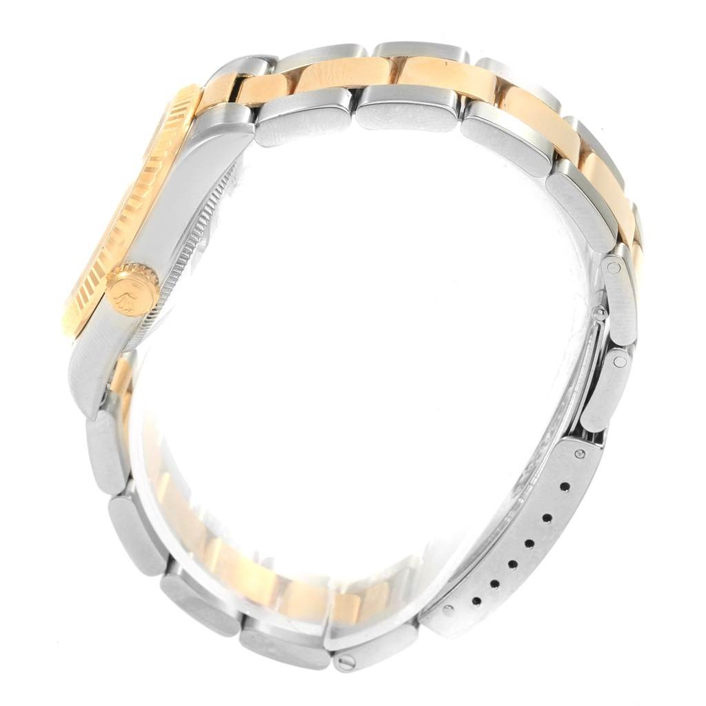 This image shows the side view of a Rolex Mid-Size 67513 Women's Steel and Gold (two tone) Black Dial 67513 Women's Steel and Gold (two tone) Black Dial watch, highlighting its two-tone bracelet and crown.