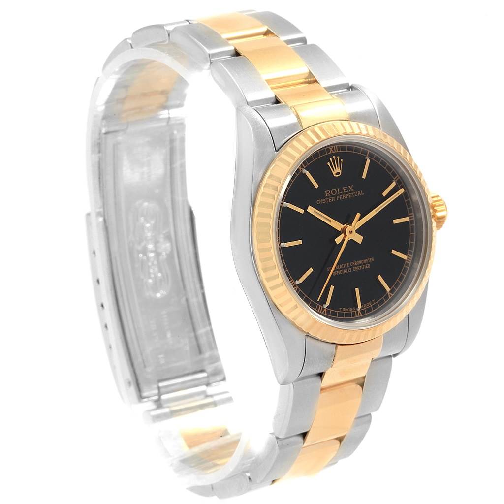 The image shows a side angle of a Mid-Size Rolex Oyster Perpetual watch, highlighting its two-tone bracelet and black dial.