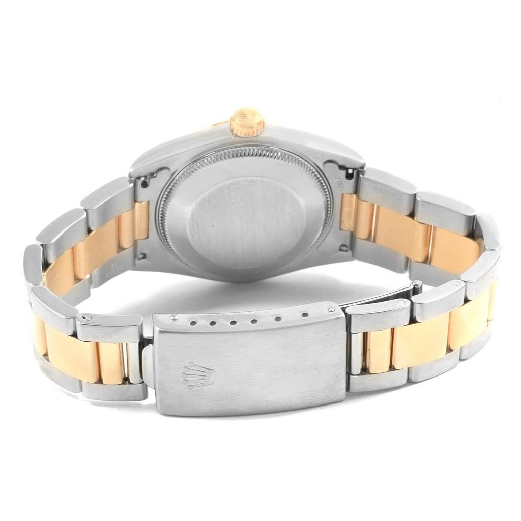 The image shows the back and clasp of a Rolex Mid-Size 67513 Women's Steel and Gold (two tone) Black Dial 67513 Women's Steel and Gold (two tone) Black Dial watch, highlighting the stainless steel and gold bracelet.