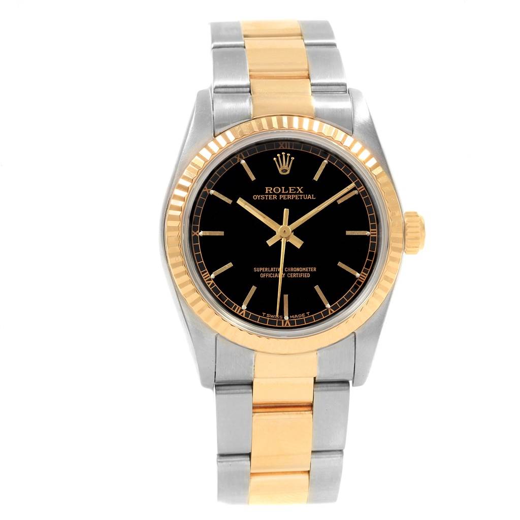 The image shows a front view of a Rolex Oyster Perpetual Mid-Size watch, highlighting its black dial and two-tone metal bracelet.