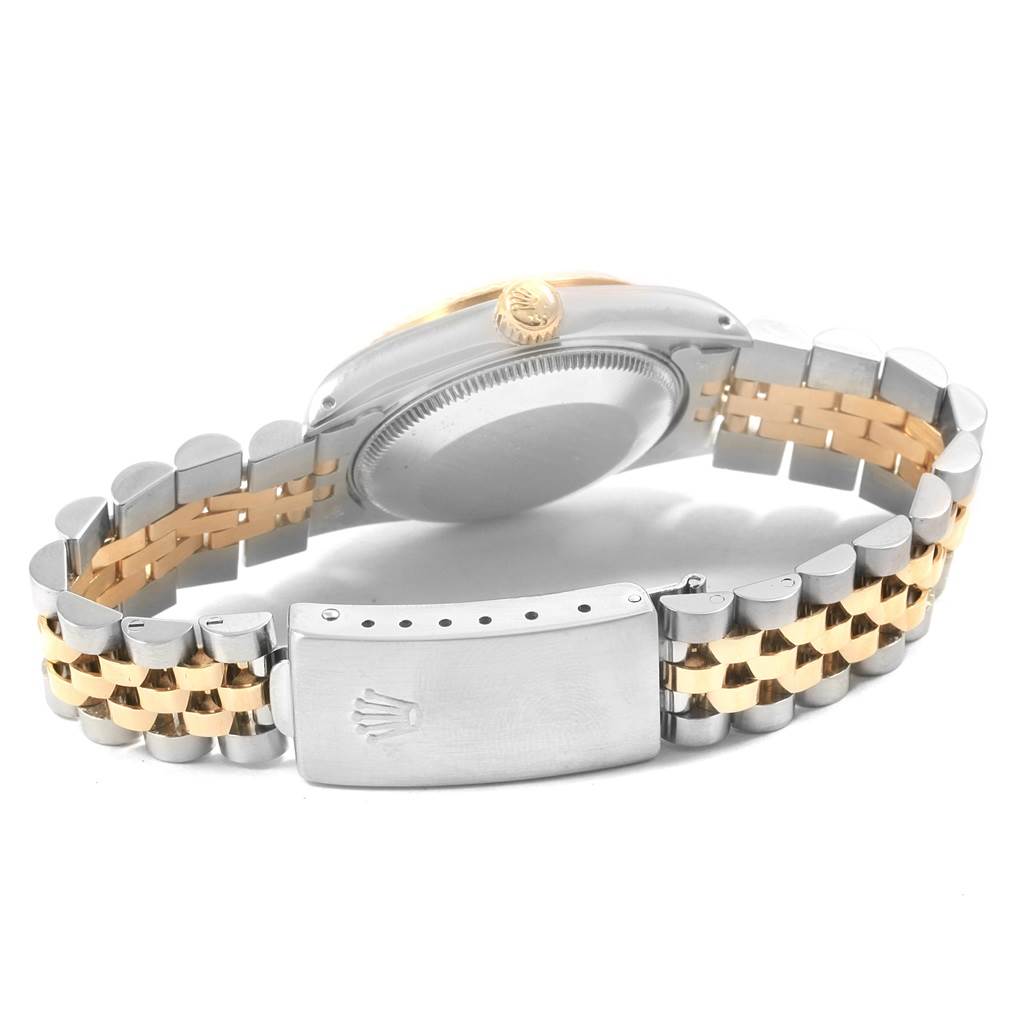 A rear angle view of a Rolex Mid-Size 68273 Women's Steel and Gold (two tone) Champagne Dial 68273 Women's Steel and Gold (two tone) Champagne Dial watch showing the case back, bracelet, and clasp.