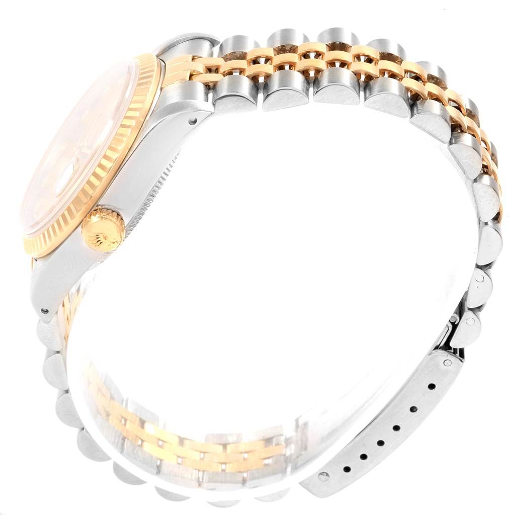 The image shows a side angle of a Mid-Size Rolex watch, highlighting the crown, bezel, and two-tone bracelet.