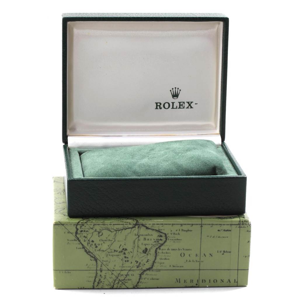 The image shows an open Rolex box for a Mid-Size model, highlighting the interior cushion and brand logo.