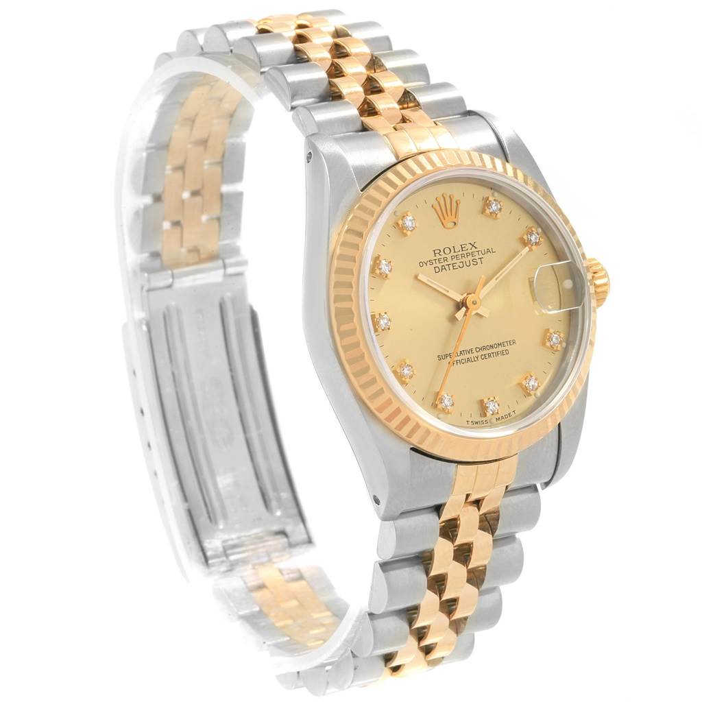 The Rolex Mid-Size 68273 Women's Steel and Gold (two tone) Champagne Dial 68273 Women's Steel and Gold (two tone) Champagne Dial Datejust is shown at an angled side view, highlighting its dial, bezel, crown, and bi-metal bracelet.