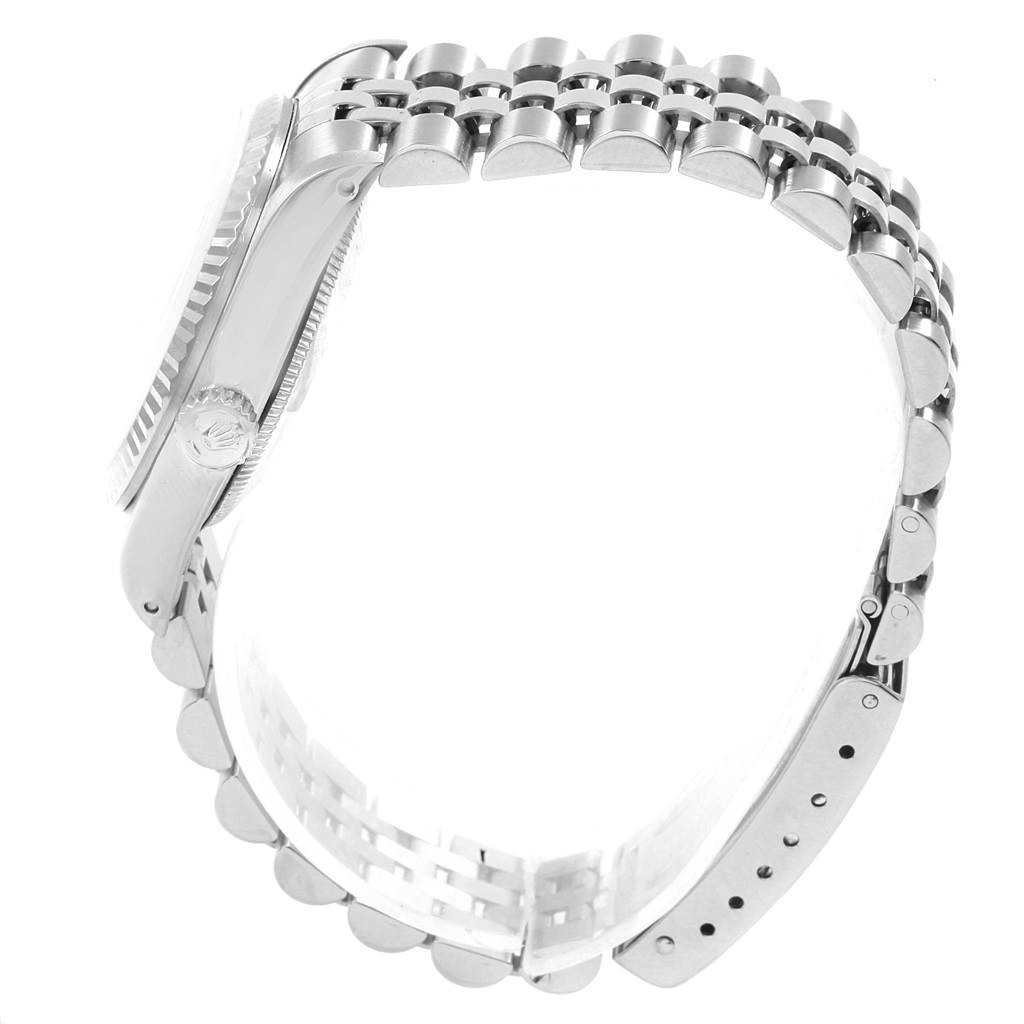 The side view of the Rolex Mid-Size 68274 Women's Stainless Steel Silver Dial 68274 Women's Stainless Steel Silver Dial model shows the case, crown, and bracelet with its clasp.