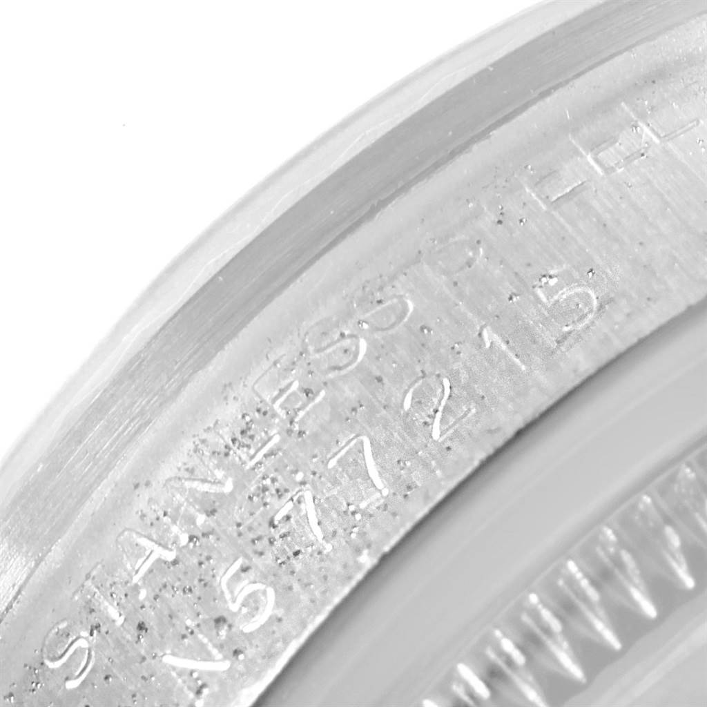 This image shows a close-up of the serial number engraving on the case of a Rolex Mid-Size 68274 Women's Stainless Steel Silver Dial 68274 Women's Stainless Steel Silver Dial model.