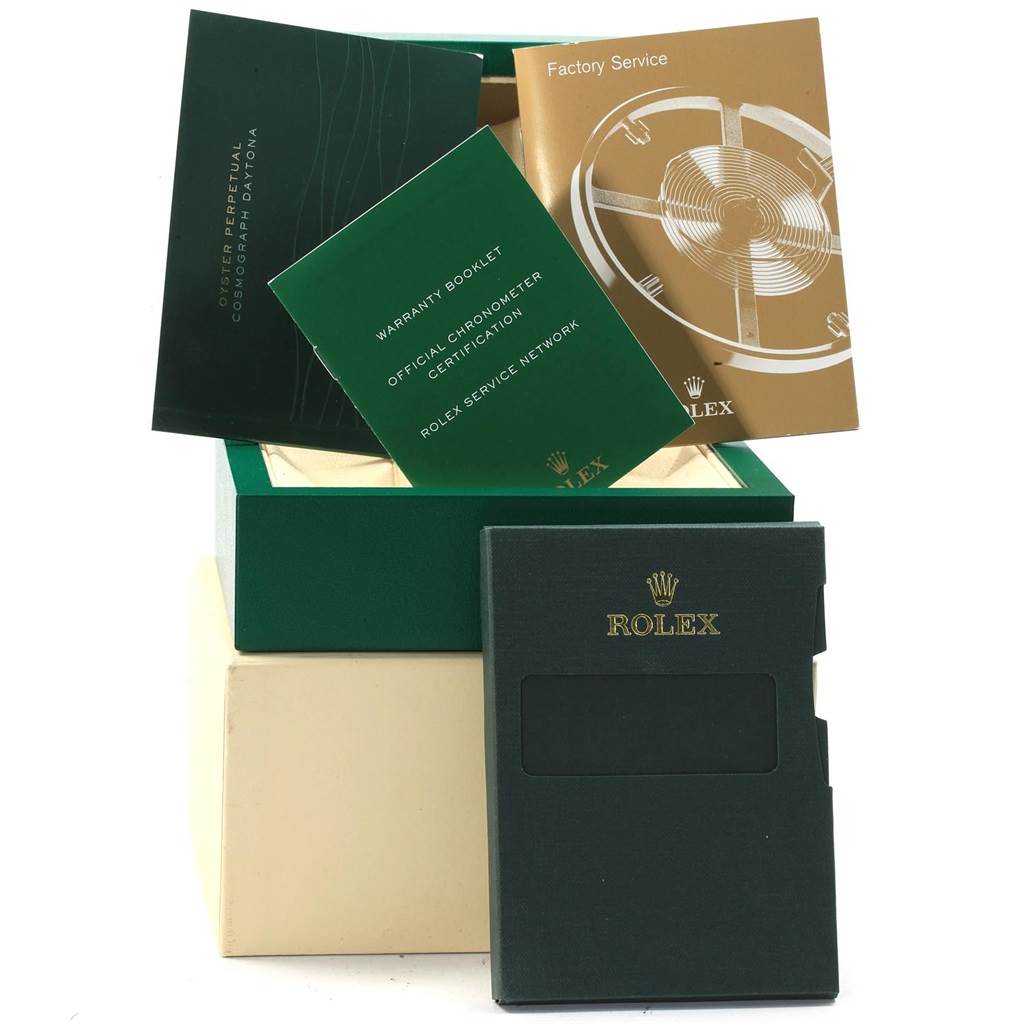 The image shows the packaging and booklets for a Mid-Size Rolex watch, including warranty booklets and service manuals.