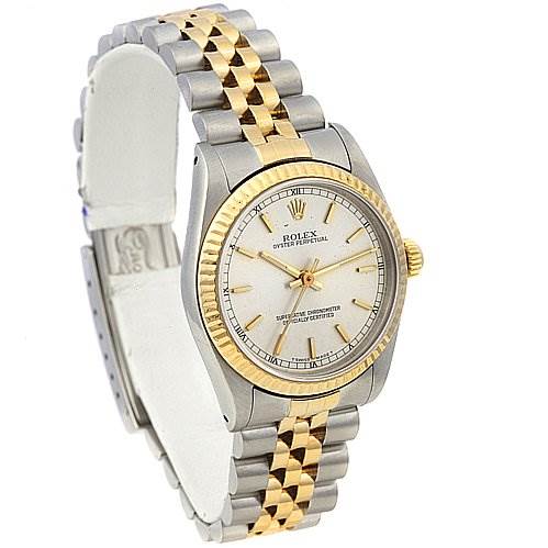 This image shows a Rolex Mid-Size 67513 Women's Stainless Steel Silver Dial 67513 Women's Stainless Steel Silver Dial watch with a partial side view highlighting its two-tone bracelet and fluted bezel.